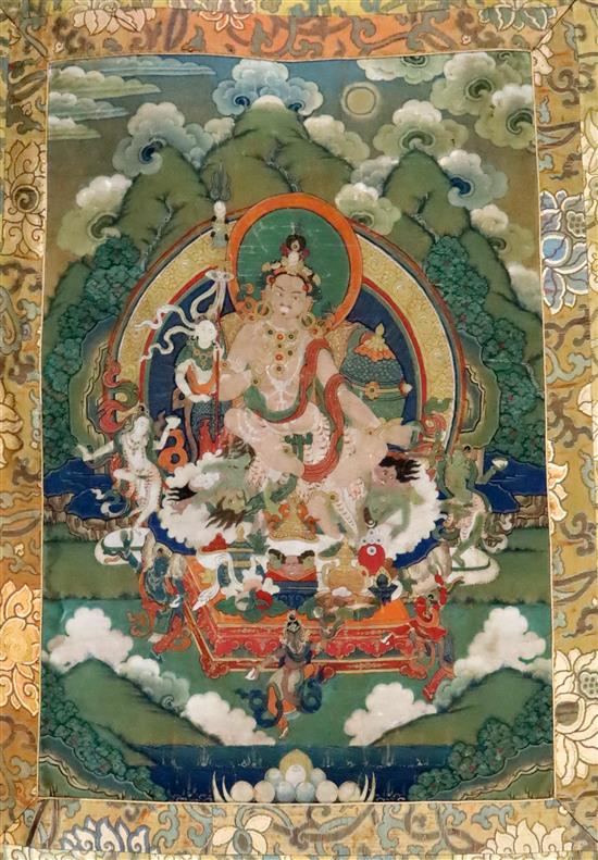 A thangka depicting Padmasambhava in the form of Nyima Ozer, Tibet, 19th century Total dimensions 133cm x 86cm